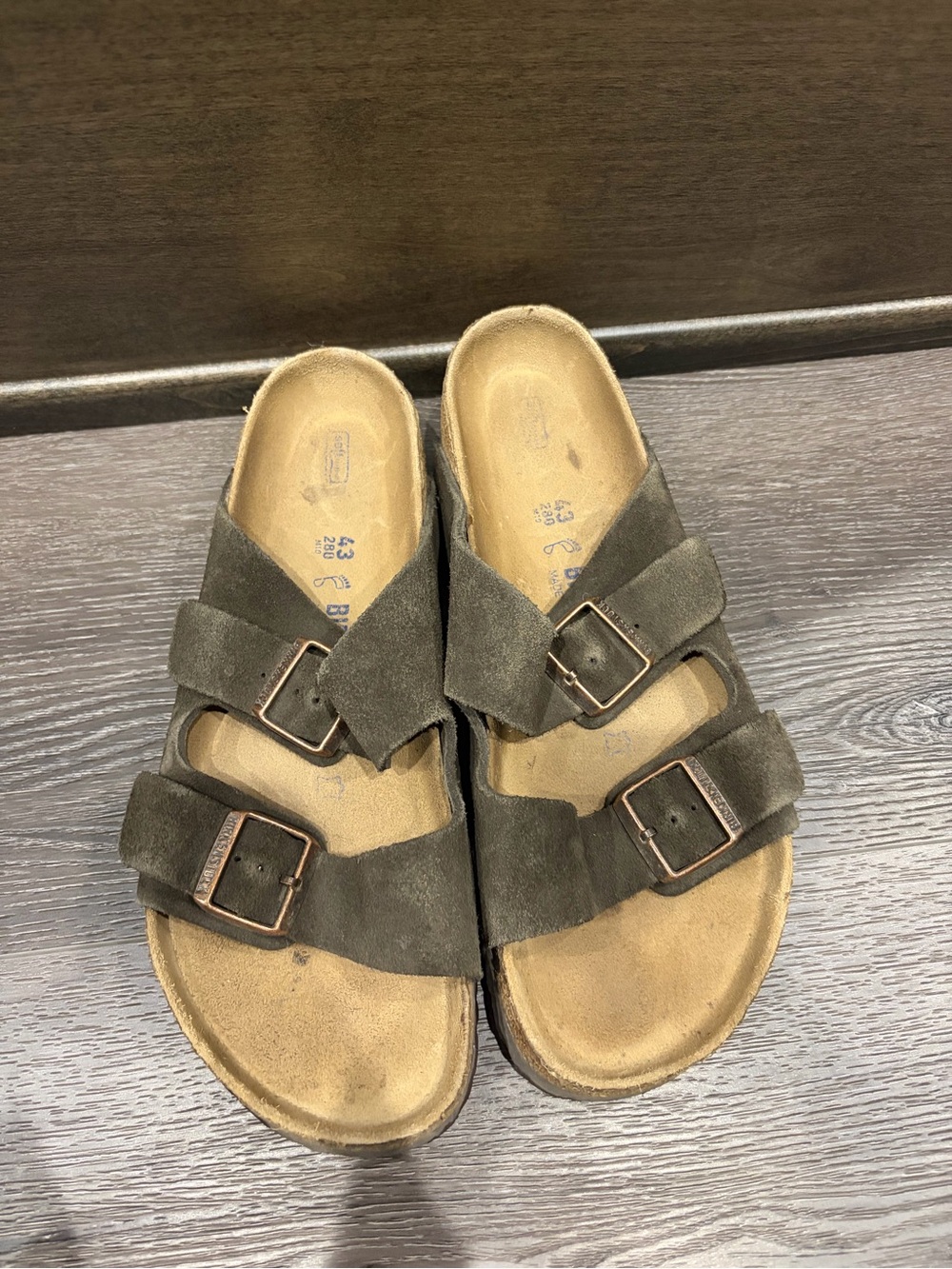 Two-strap suede slide sandals in olive with bronze buckles
